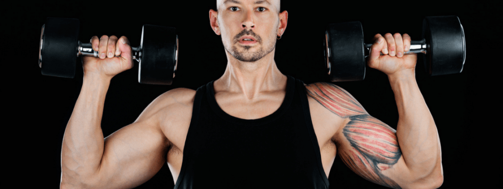 A man doing an overhead press with weights
