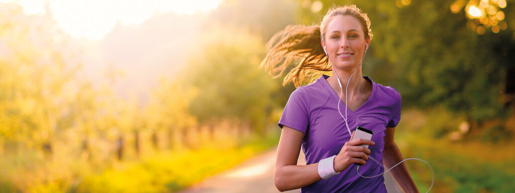 Woman walking whilst listening to music