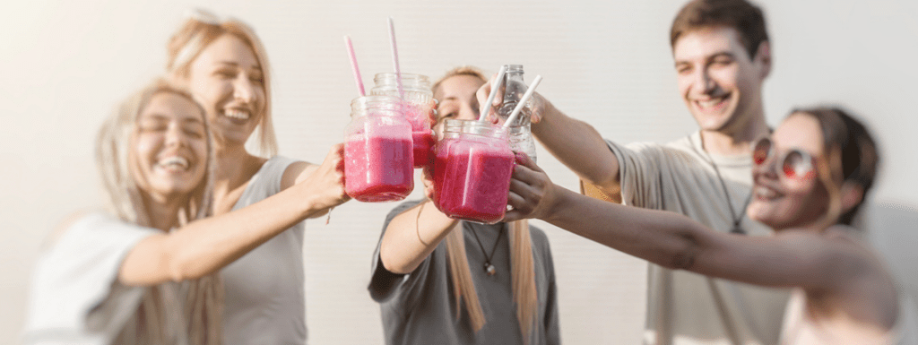 People clinking juices together