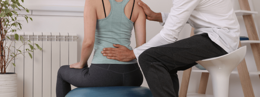 A man supporting a woman through Corrective Exercise
