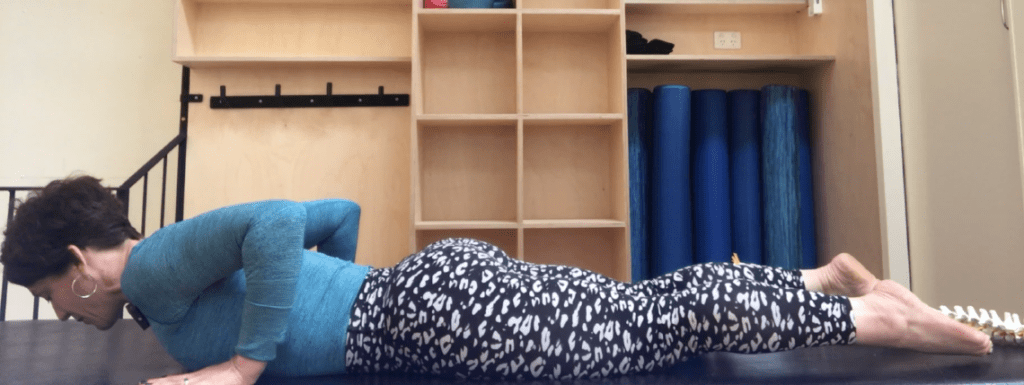 An image of Pilates instructor Stephanie Glickman channeling her cobra