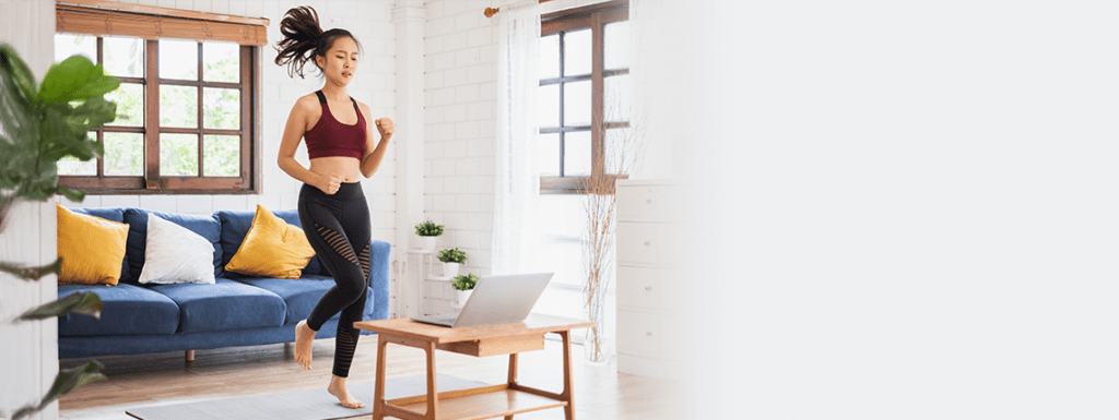 A woman engaged in an online fitness class