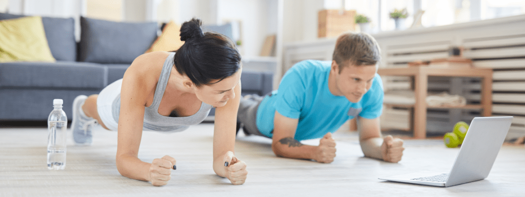 A couple exercising at home