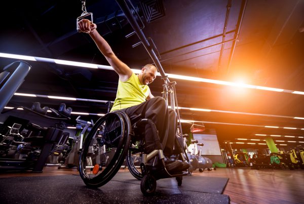 Neurological conditions - Male wheelchair user training in the gym