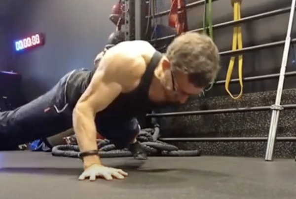 Fitness career - Image of Olly Jeffrey doing a one handed press-up
