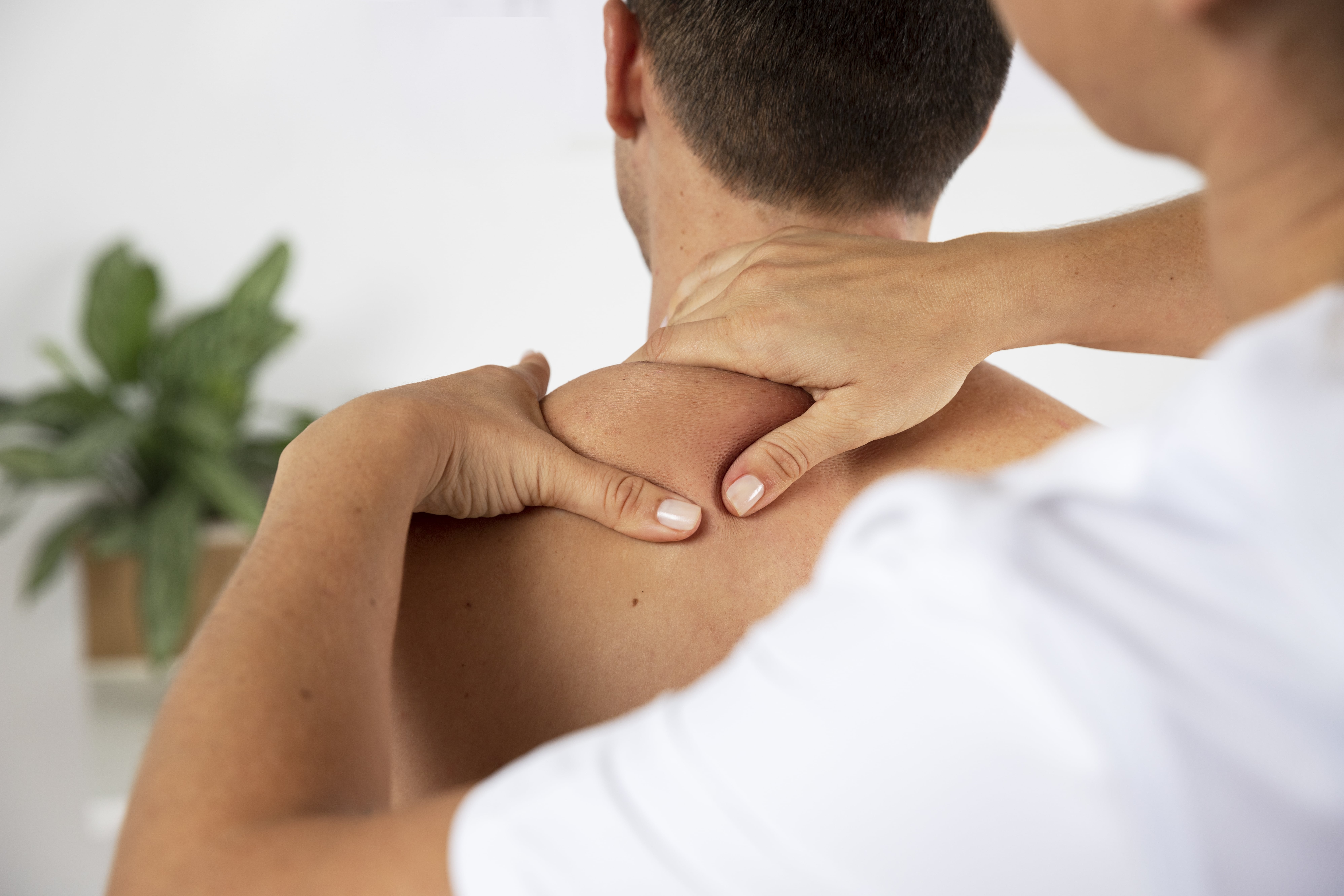 Sports Massage Therapist providing a massage to a client