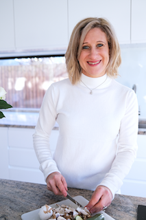 Headshot of Jodi Montlake chopping food. Jodi is the author of this blog on Dementia.