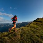 Strength and power training for endurance running. Woman running athletically up a hill.