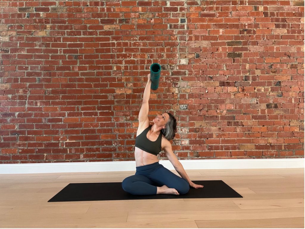 vipr for teaching spinal shapes - Stephanie Glickman is lying on a mat demonstarting a side bend sequence with ViPR