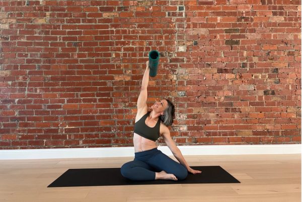 vipr for teaching spinal shapes - Stephanie Glickman is lying on a mat demonstarting a side bend sequence with ViPR