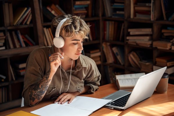 what is cpd and how to claim points - image of young person looking at their laptop with headphones on
