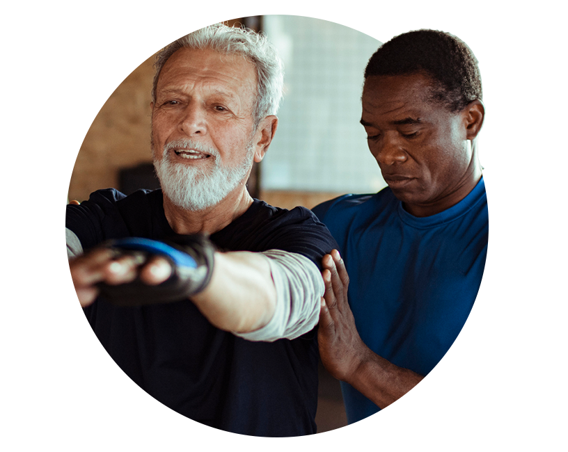 personal trainer helping older man