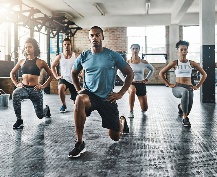 A group exercise session of squats