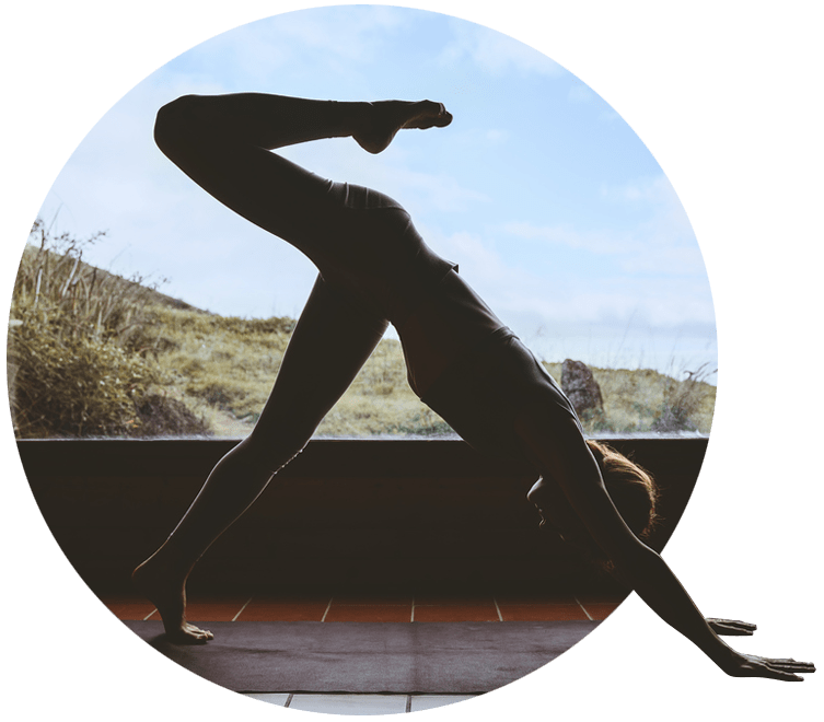 Person performing a yoga pose on an exercise mat