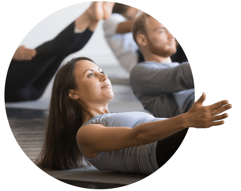 Woman performing pilates in an exercise class