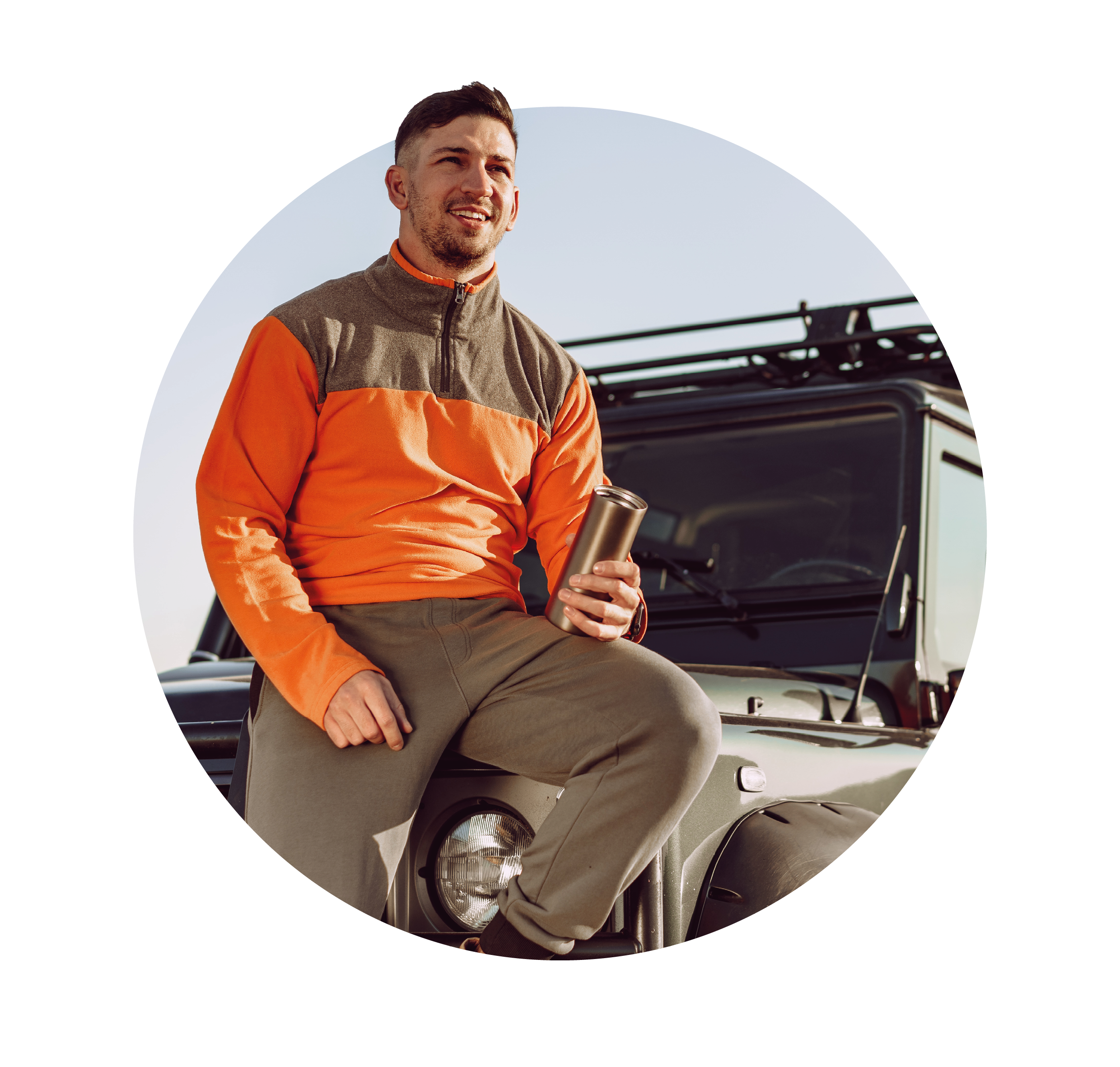 man perched on boot of car
