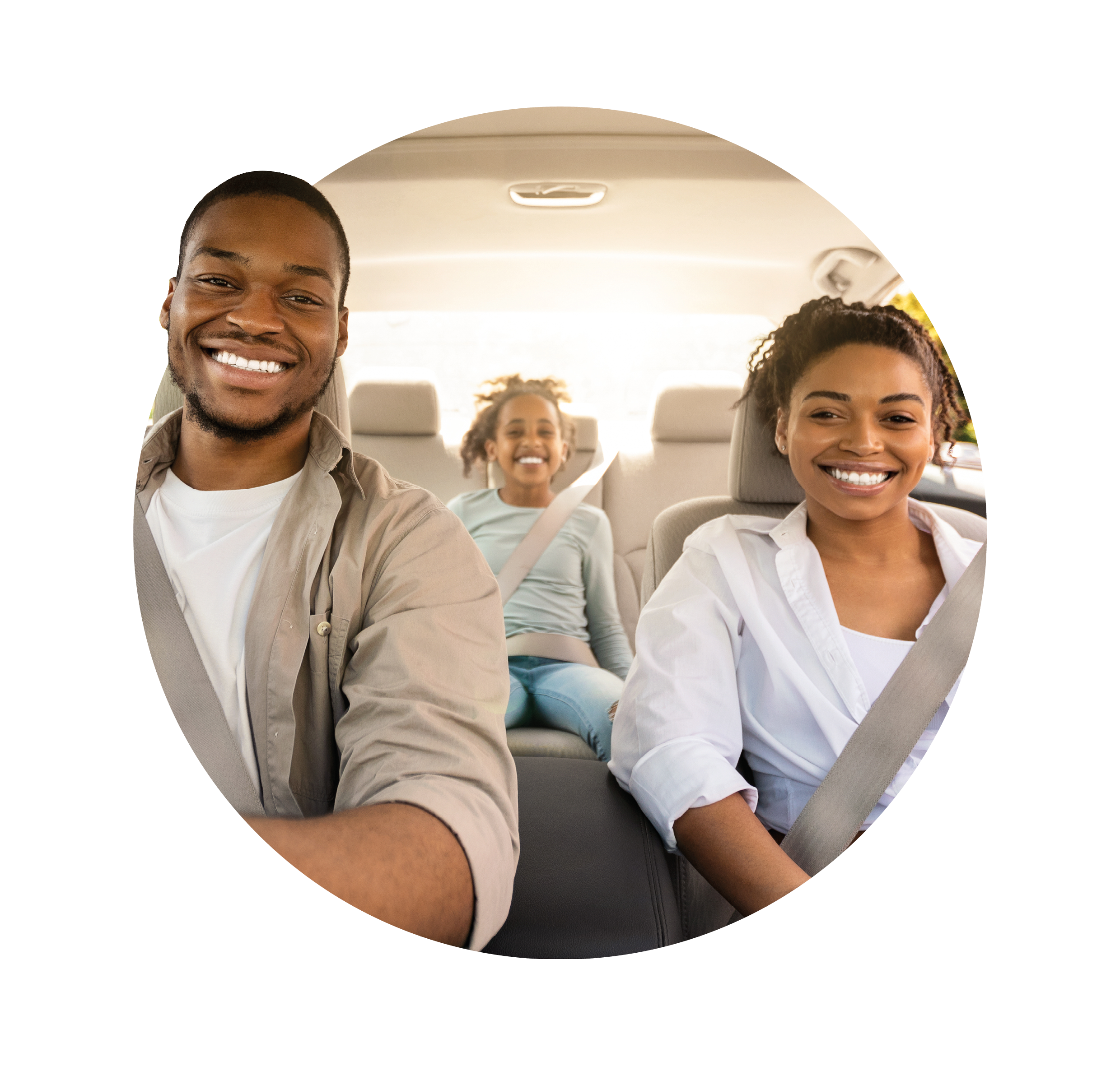 family in car smiling at camera